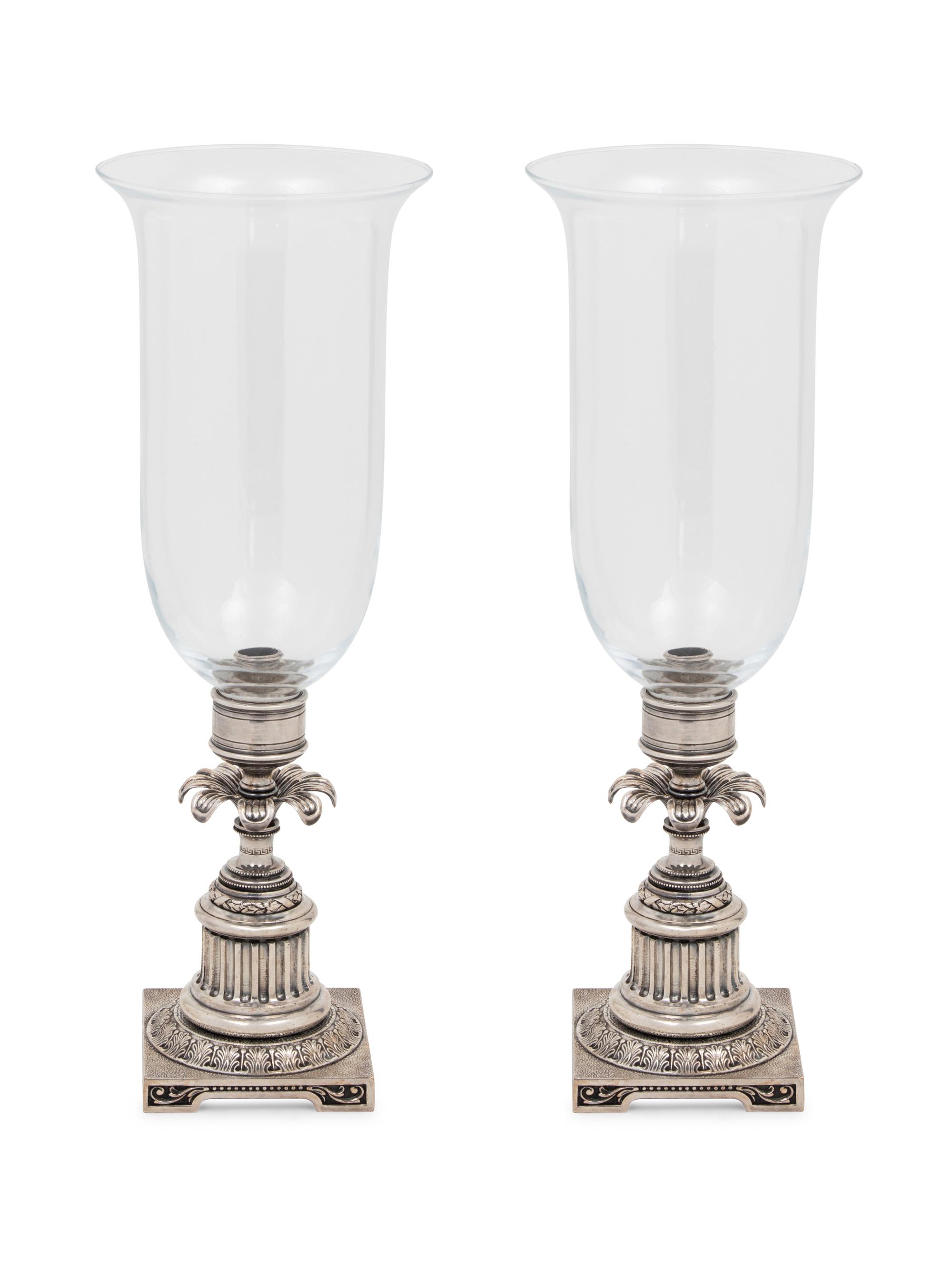 A Pair of Silvered-Metal and Glass Hurricane Candlesticks