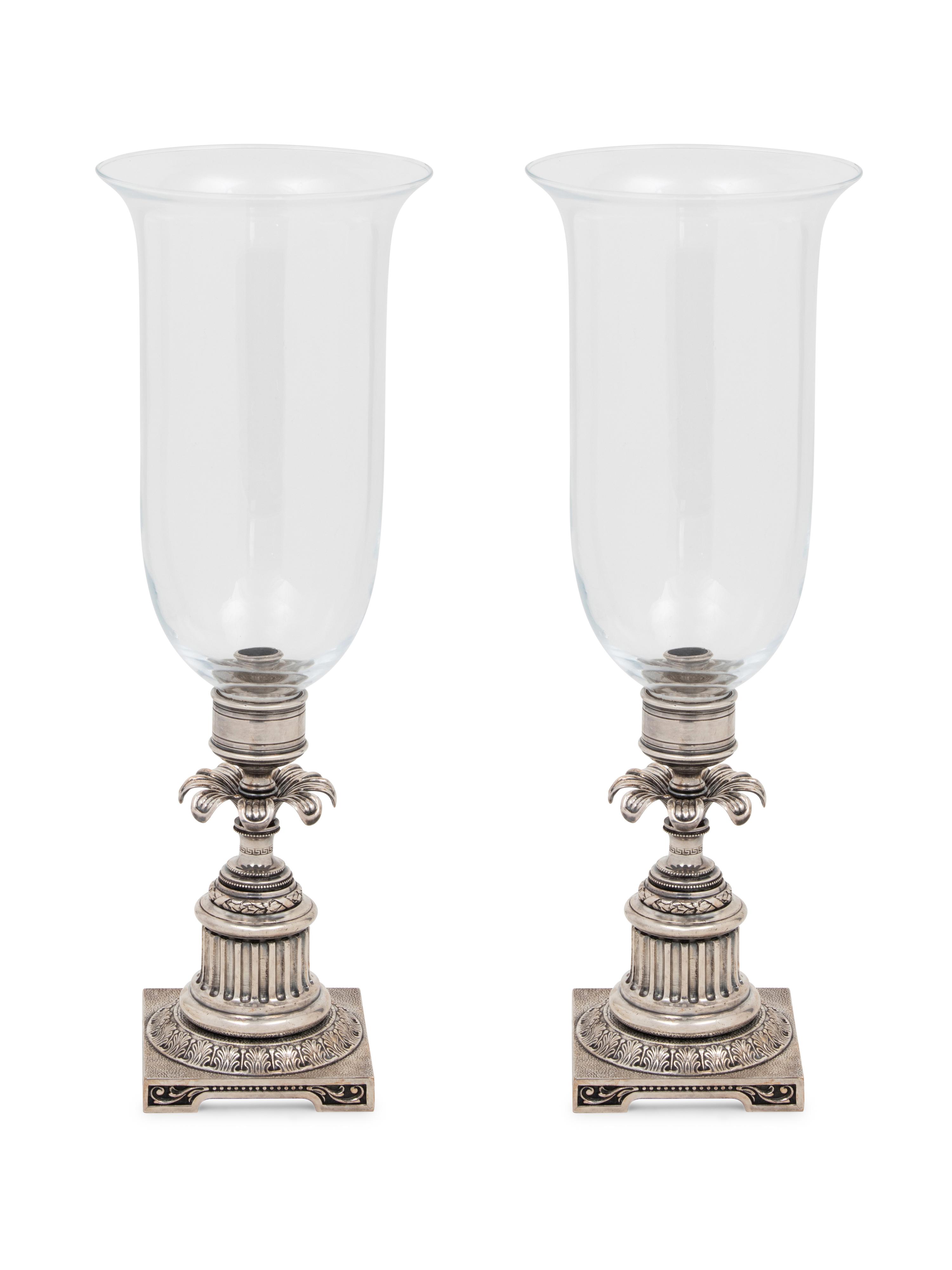 A Pair of Silvered-Metal and Glass Hurricane Candlesticks