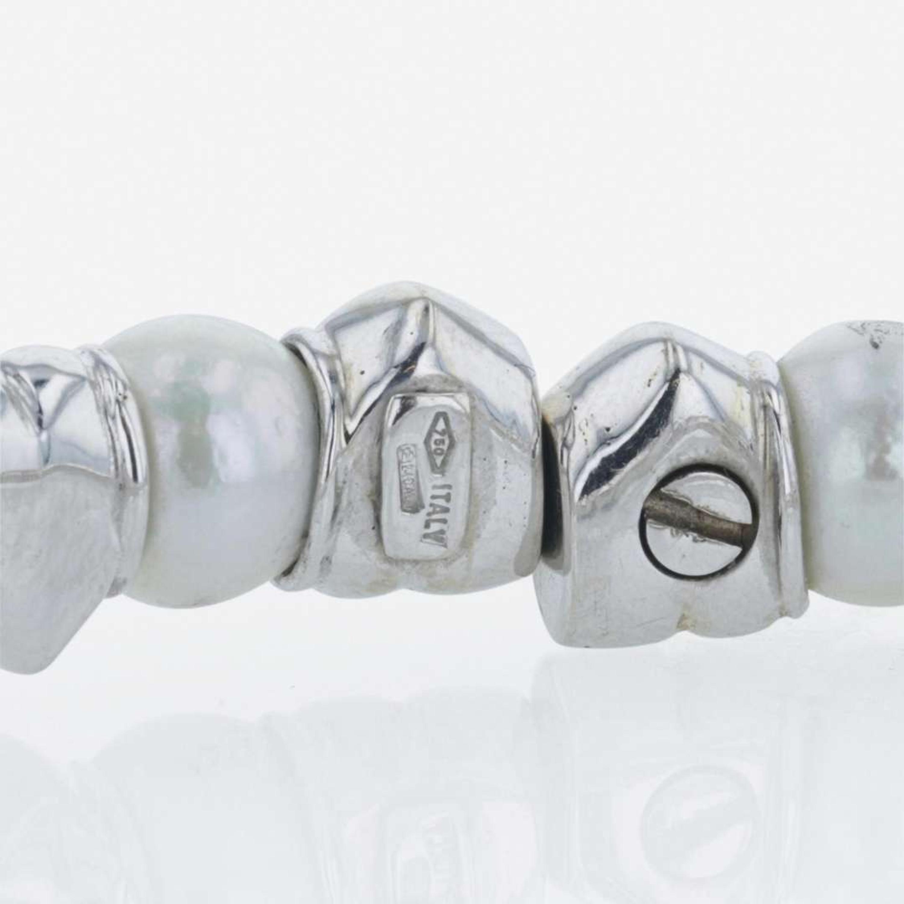 An 18K white gold, cultured pearl, and diamond bangle Italy