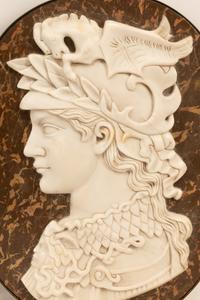 A Set of Four Iron-Framed Marble Portrait Medallions