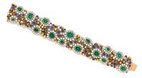 A Platinum, Yellow Gold, Diamond, Emerald and Sapphire Bracelet, 17.30 dwts.