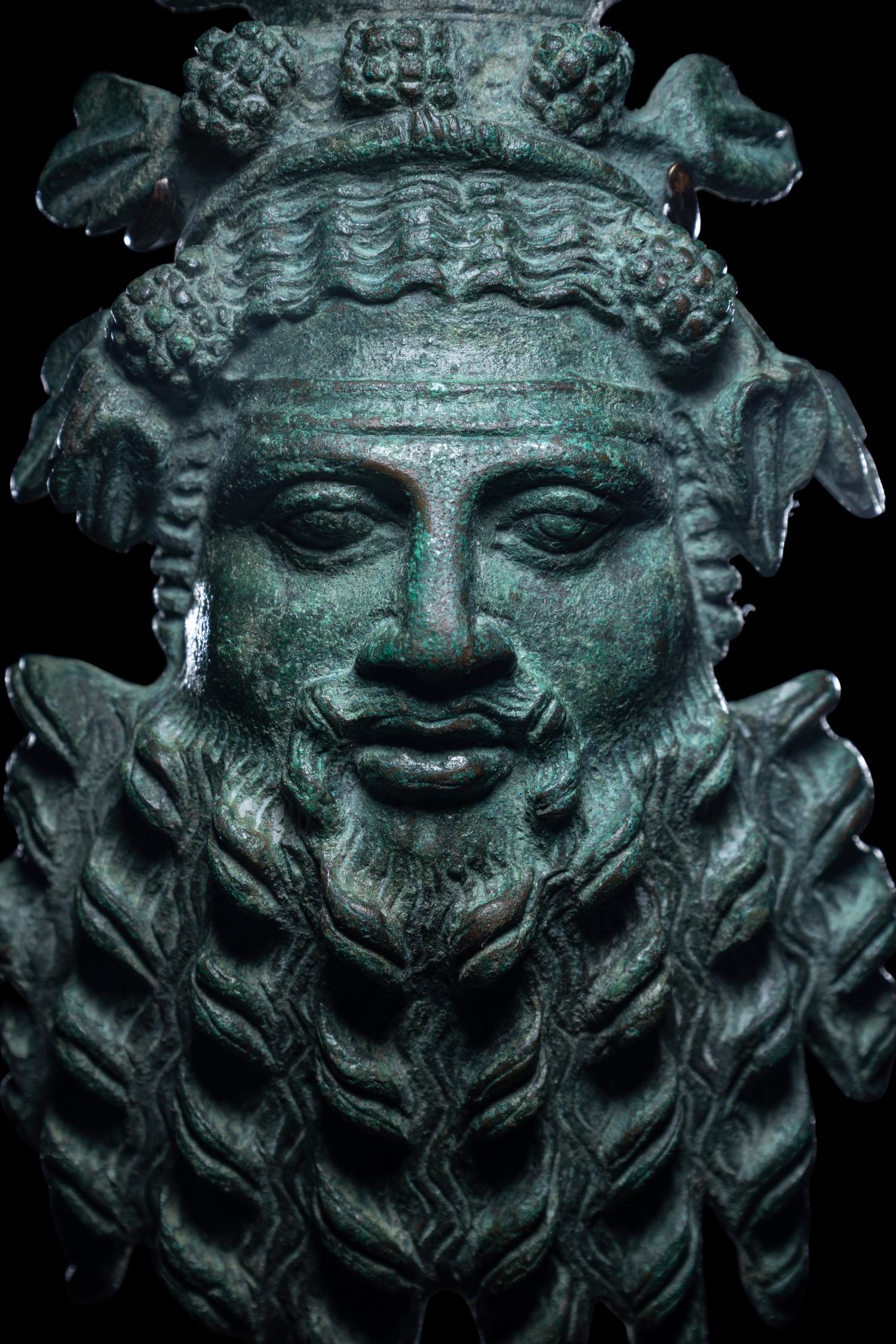 A Roman Bronze Applique Mask in the Form of Silenus