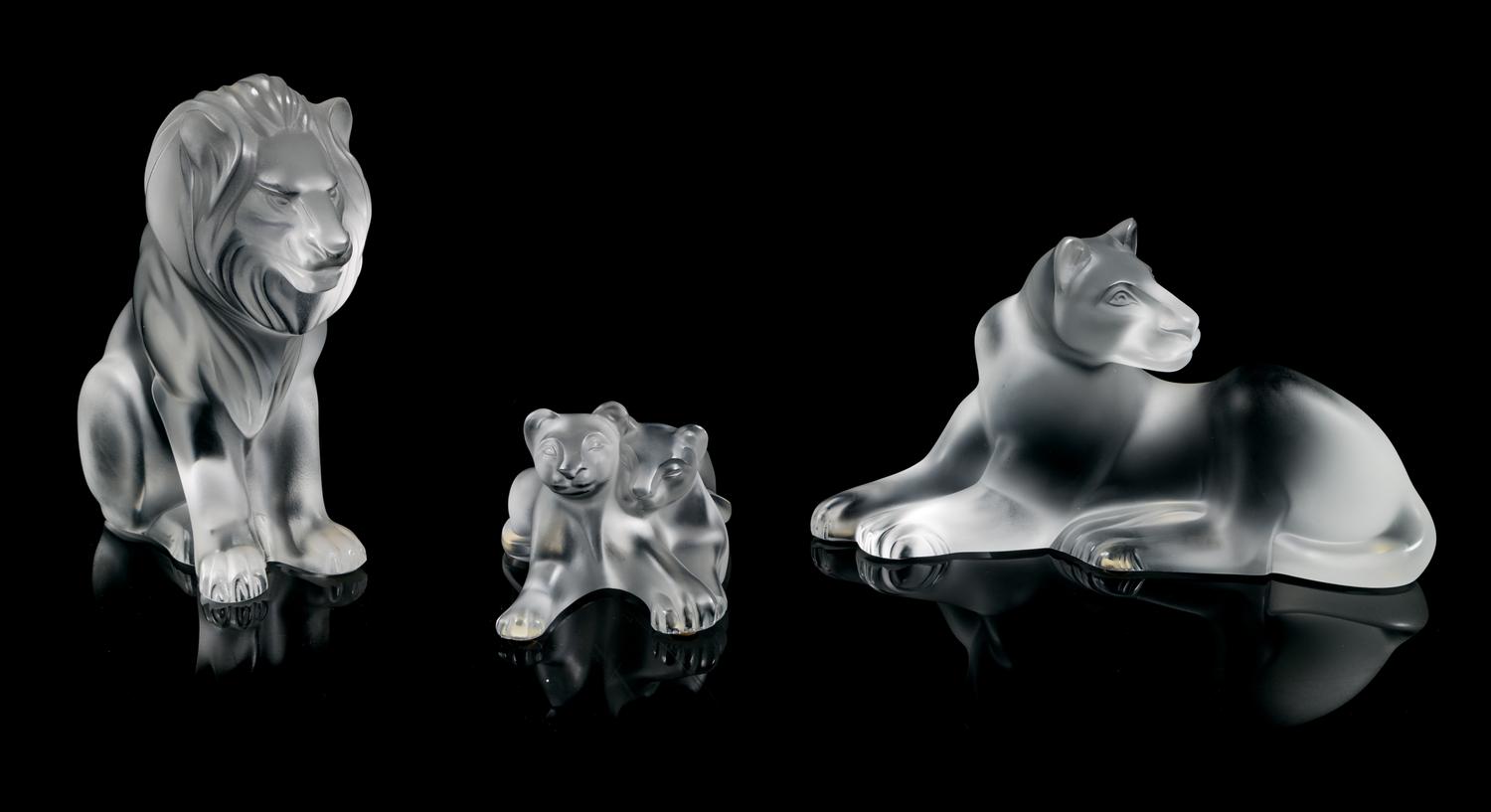 Lalique, a molded and frosted glass figural group, comprising a lioness, lion, and lion cubs