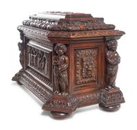 A Renaissance Revival Carved Oak Cellarette
