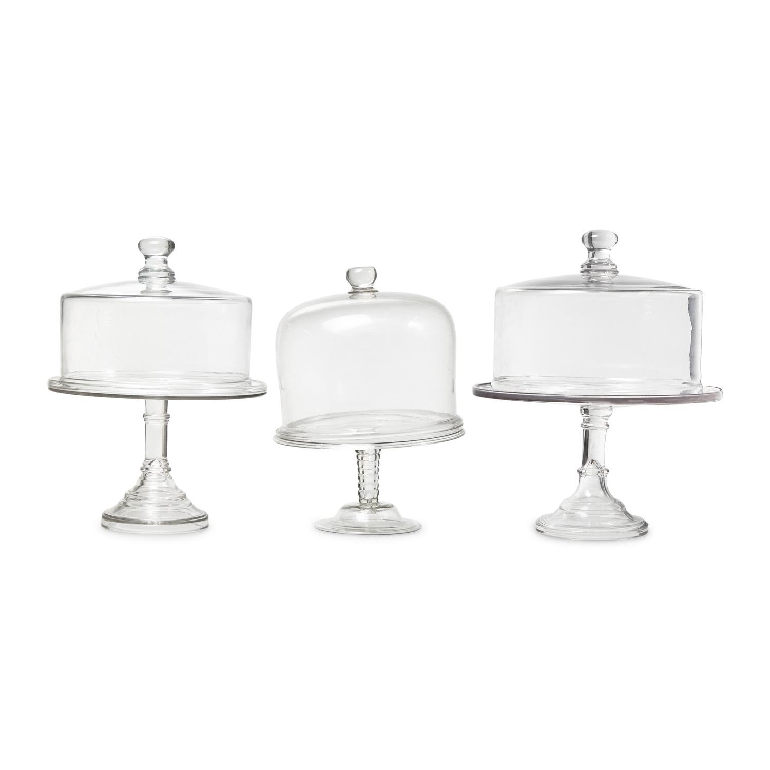A Group of Nine Blown and Cast Glass Footed Cake Plates and Covers