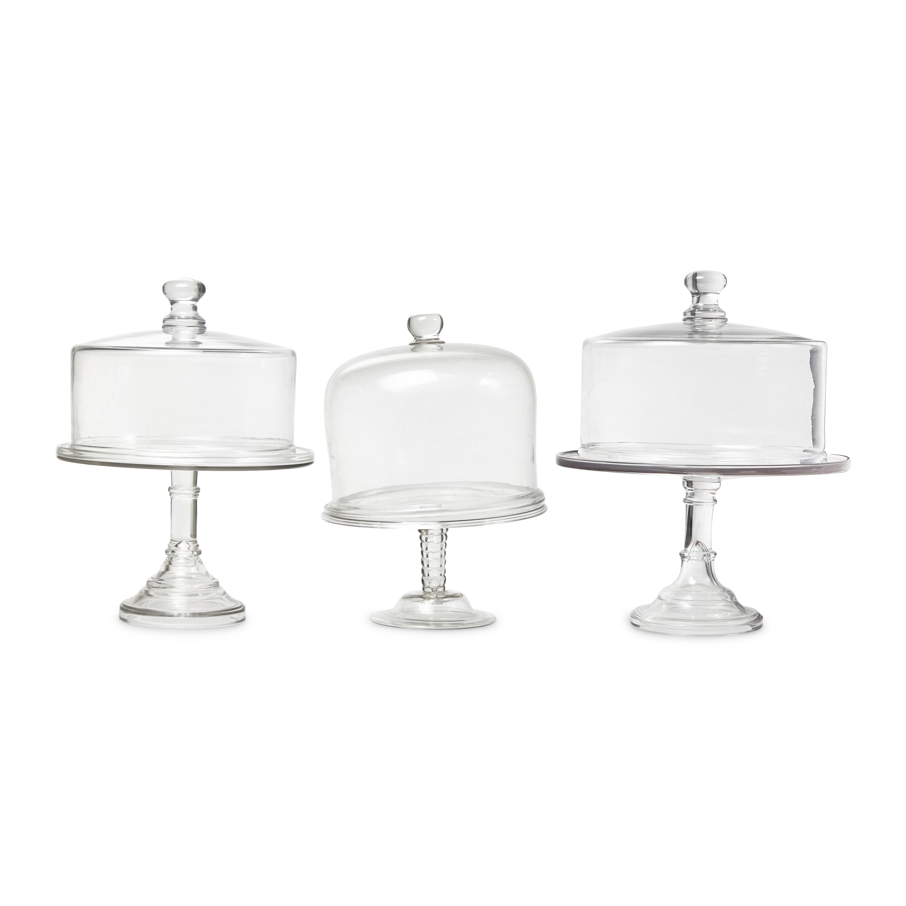 A Group of Nine Blown and Cast Glass Footed Cake Plates and Covers