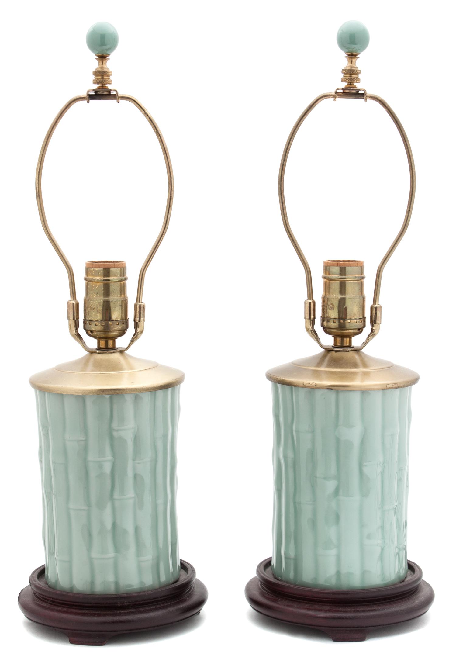 A Pair of Celadon Glazed Porcelain Lamps Height overall 19 inches.