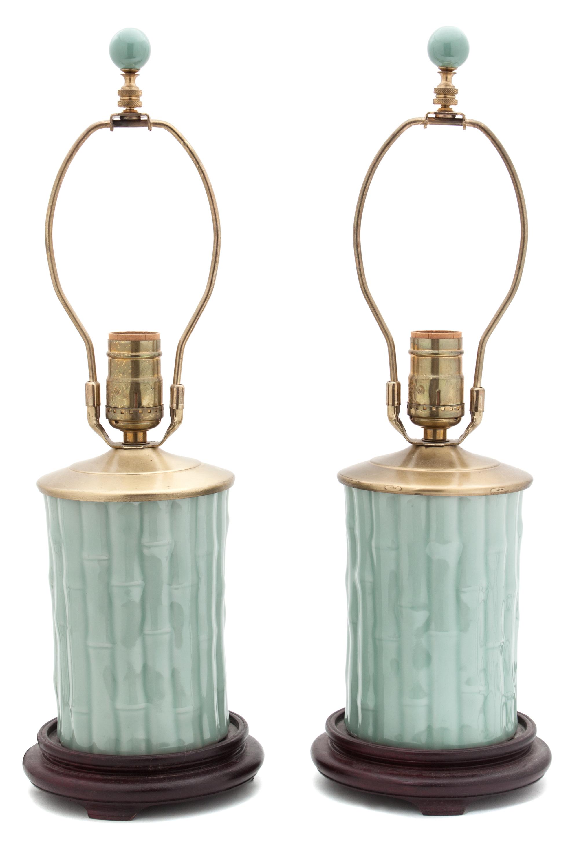 A Pair of Celadon Glazed Porcelain Lamps Height overall 19 inches.