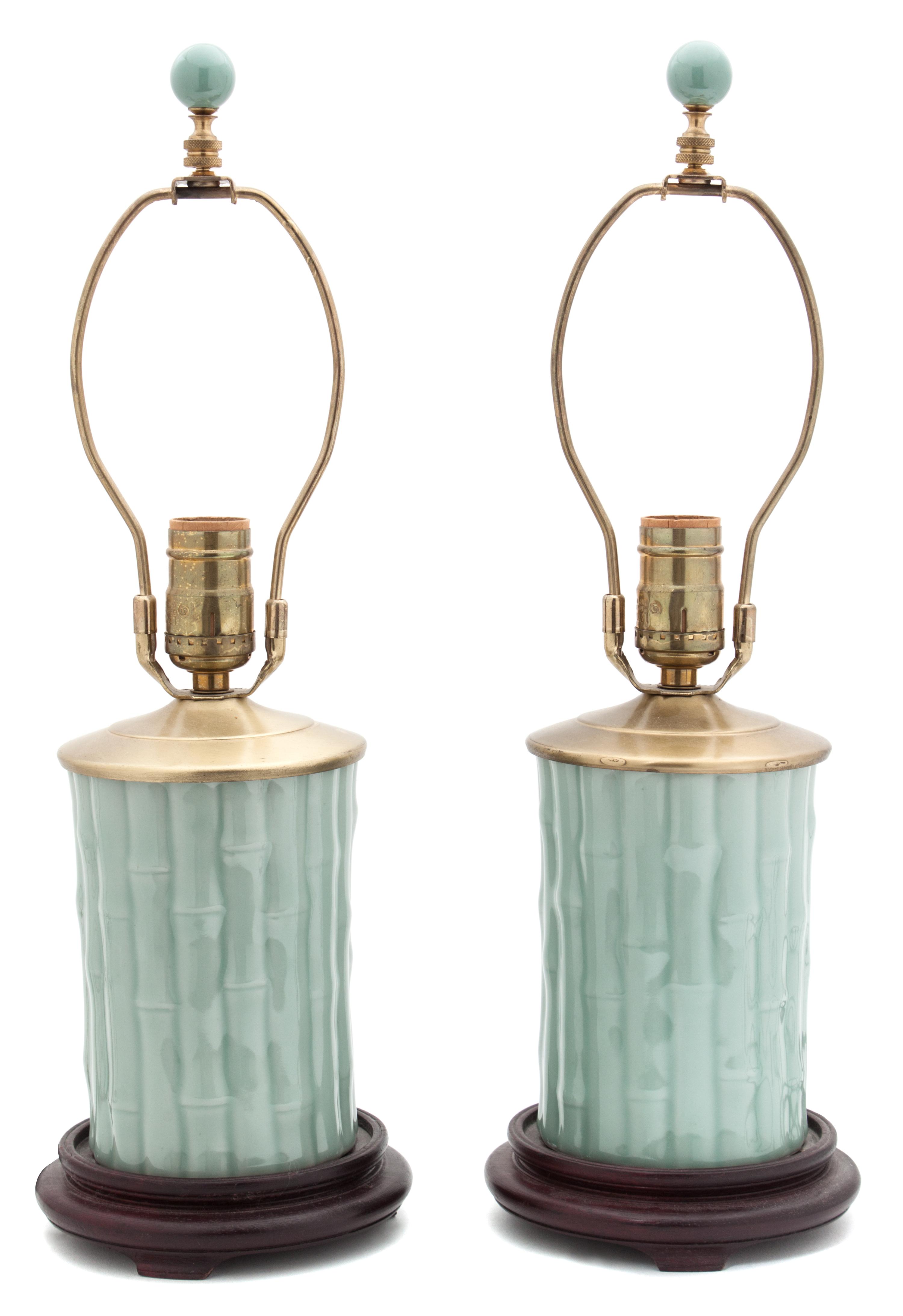 A Pair of Celadon Glazed Porcelain Lamps Height overall 19 inches.