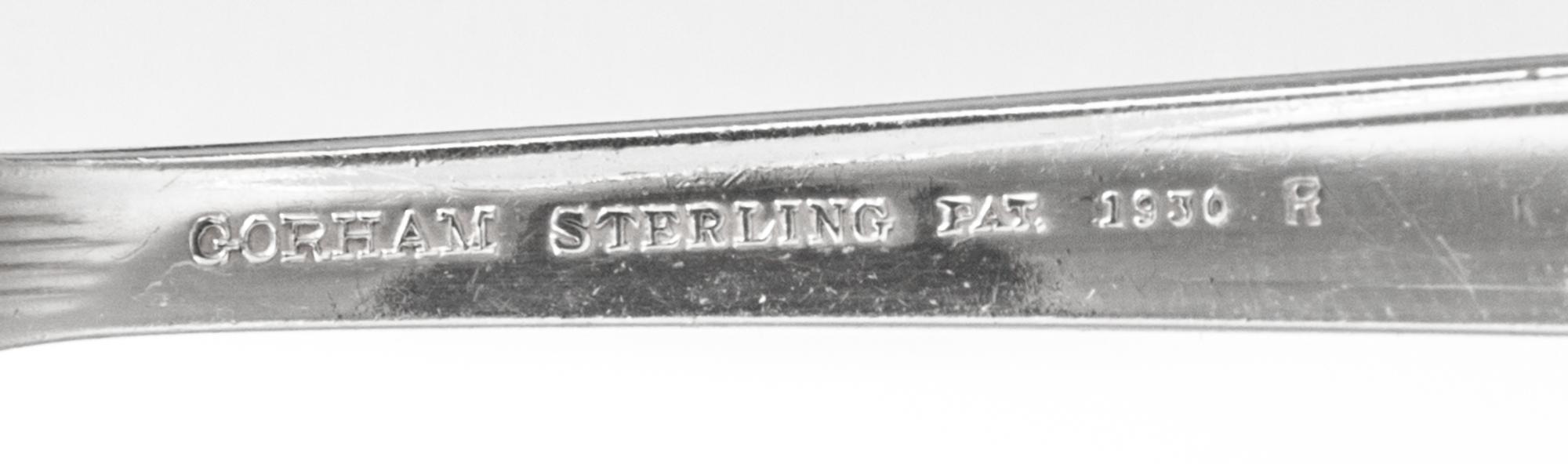 An American Silver Flatware Service, Gorham Mfg. Co., Providence, RI, Hunt Club pattern, comprising: 12 dinner knives 11 dinner forks 1