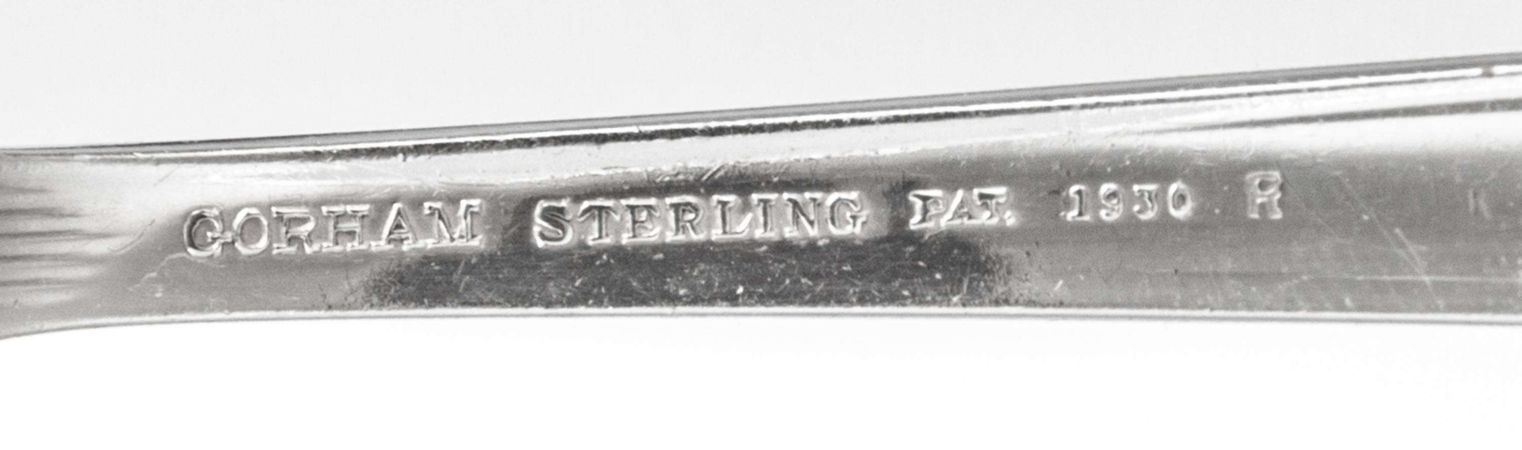 An American Silver Flatware Service, Gorham Mfg. Co., Providence, RI, Hunt Club pattern, comprising: 12 dinner knives 11 dinner forks 1