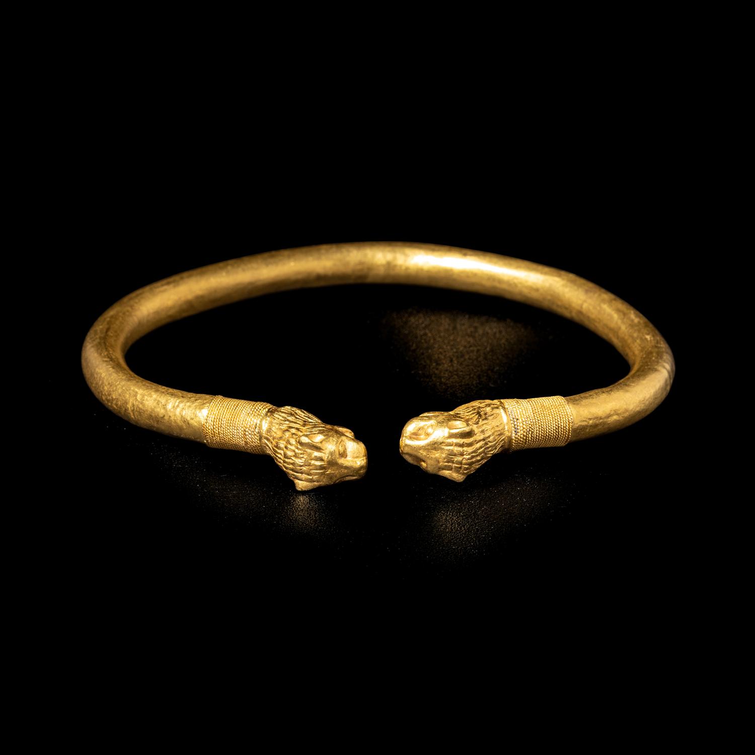 A Greek or Achaemenid Gold Bracelet with Lion Terminals