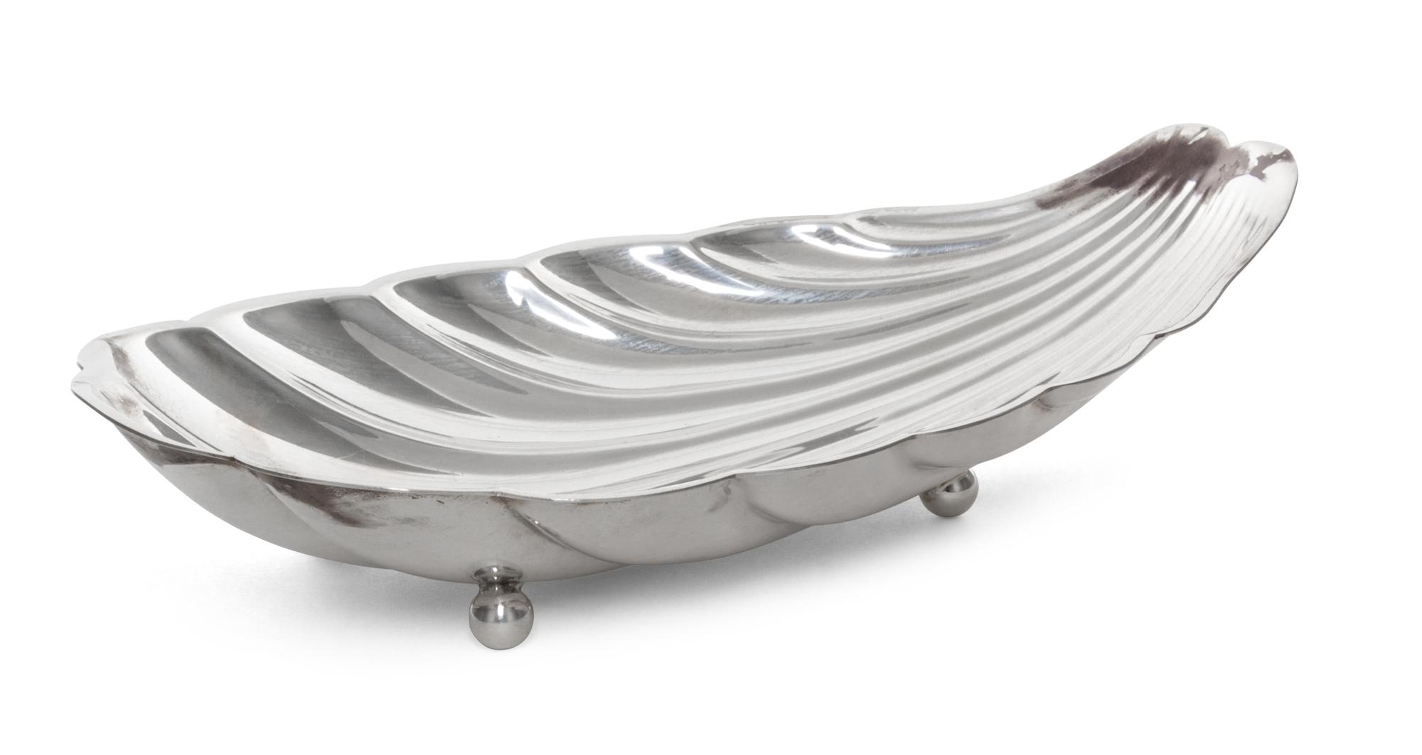 An American Silver Bowl, Reed & Barton, Taunton, MA, of elongated shell form with four spherical feet.