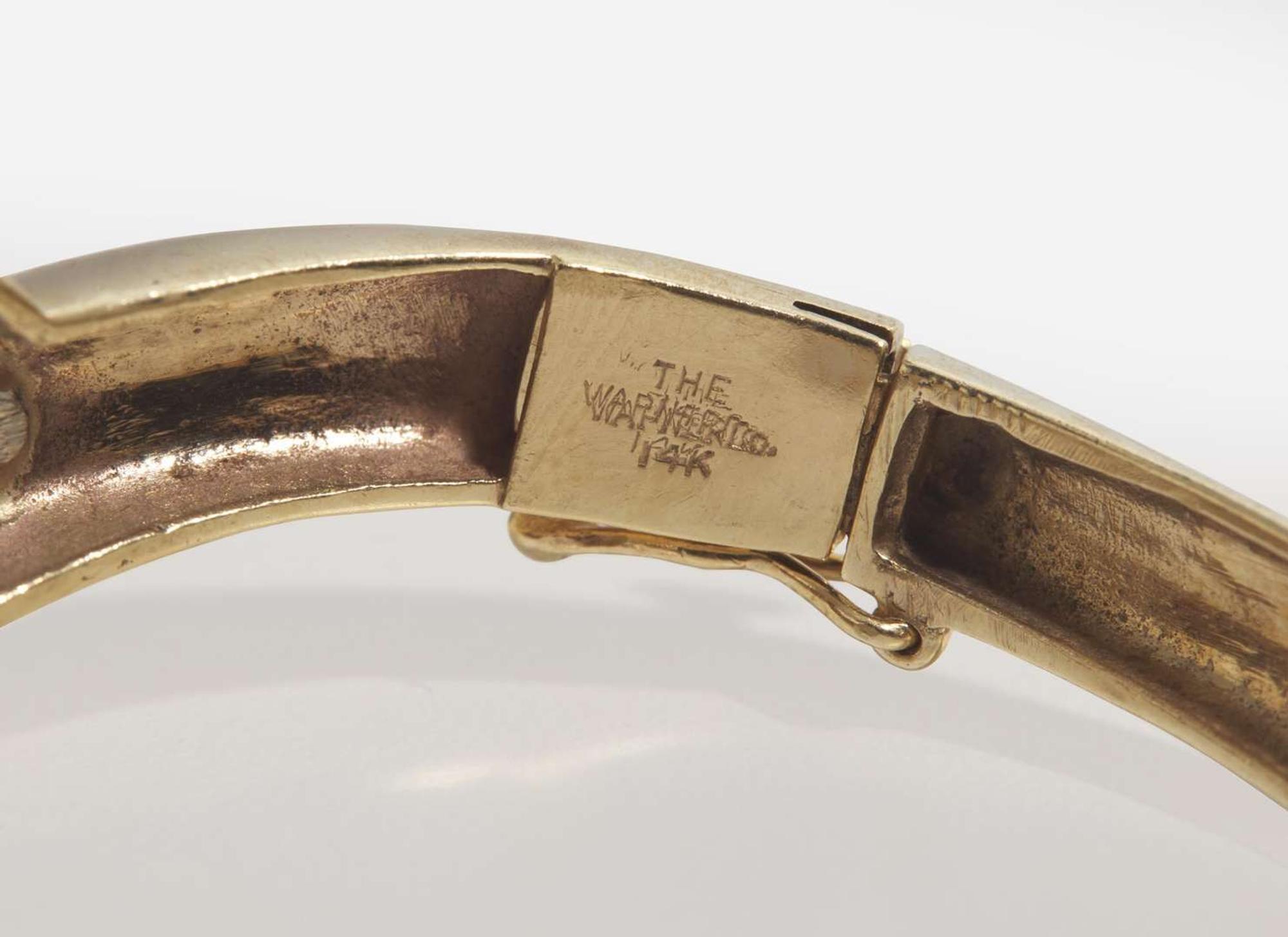 A 14K Yellow Gold and Garnet Bangle Bracelet