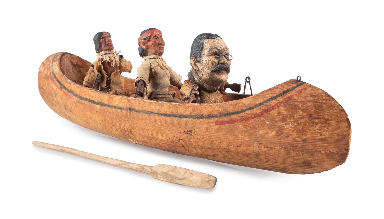 [ROOSEVELT, Theodore (1858-1919)]. Folk art canoe and figures representing Theodore Roosevelt's exploration of the River of Doubt during his expedition to Brazil in 1913-1914.
