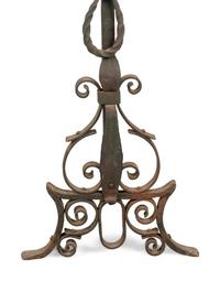 A Pair of Continental Iron Andirons