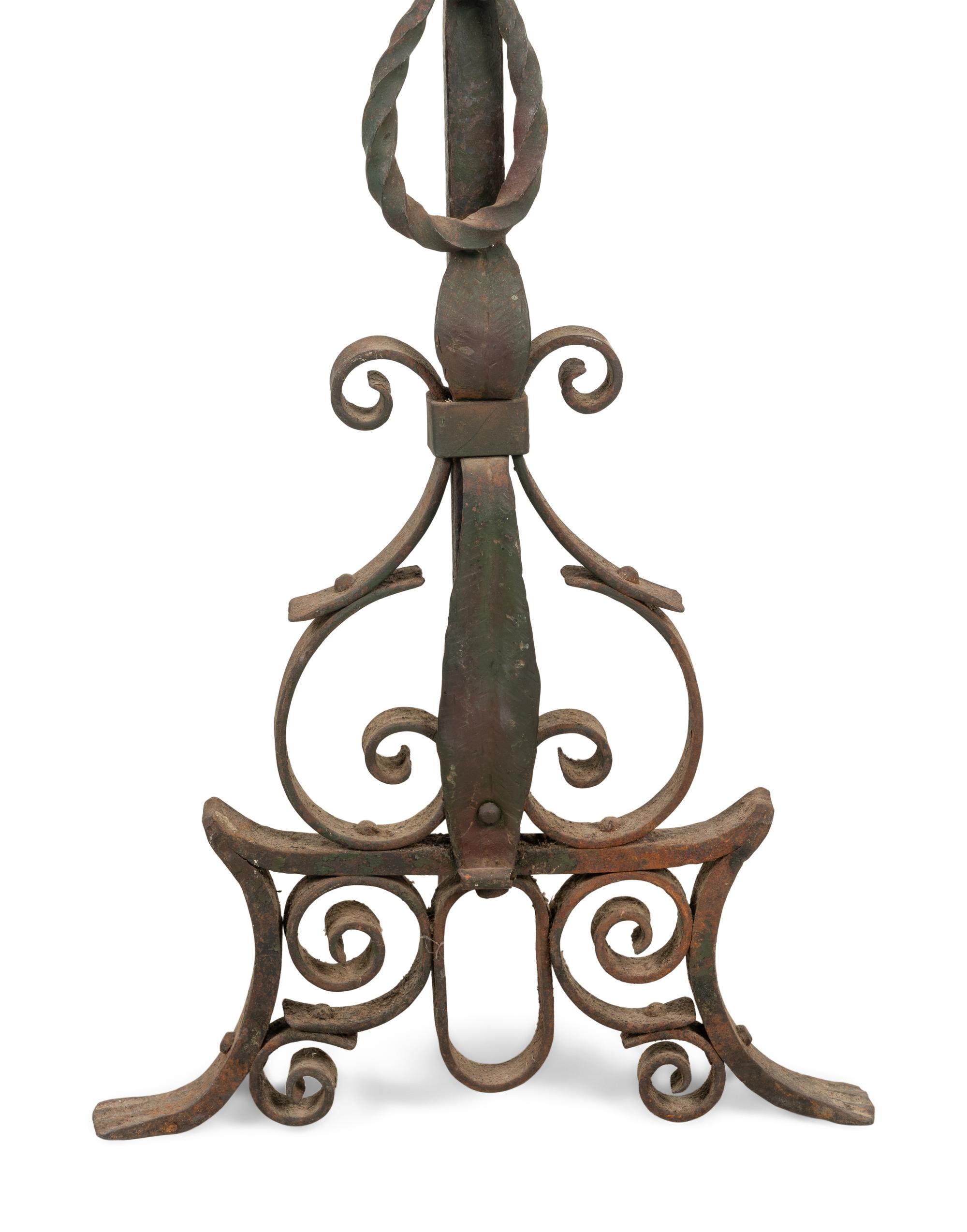 A Pair of Continental Iron Andirons