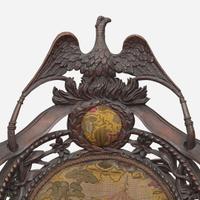 A Rococo revival carved oak fire company armchair circa 1860