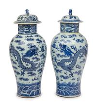 A Near Pair of Chinese Porcelain Covered Vases