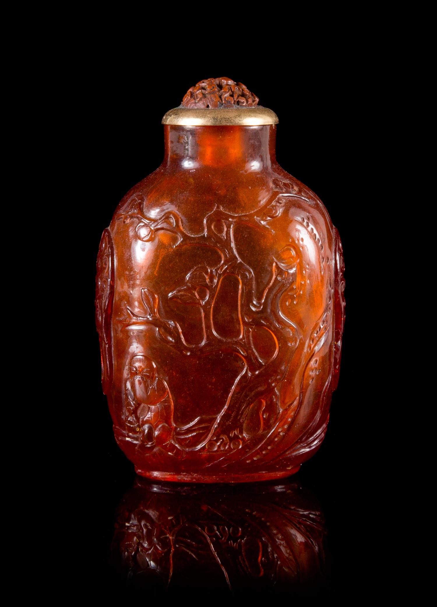 A Carved Amber Snuff Bottle Height 2 3/4 inches. — QIANLONG PERIOD (1736-1795)