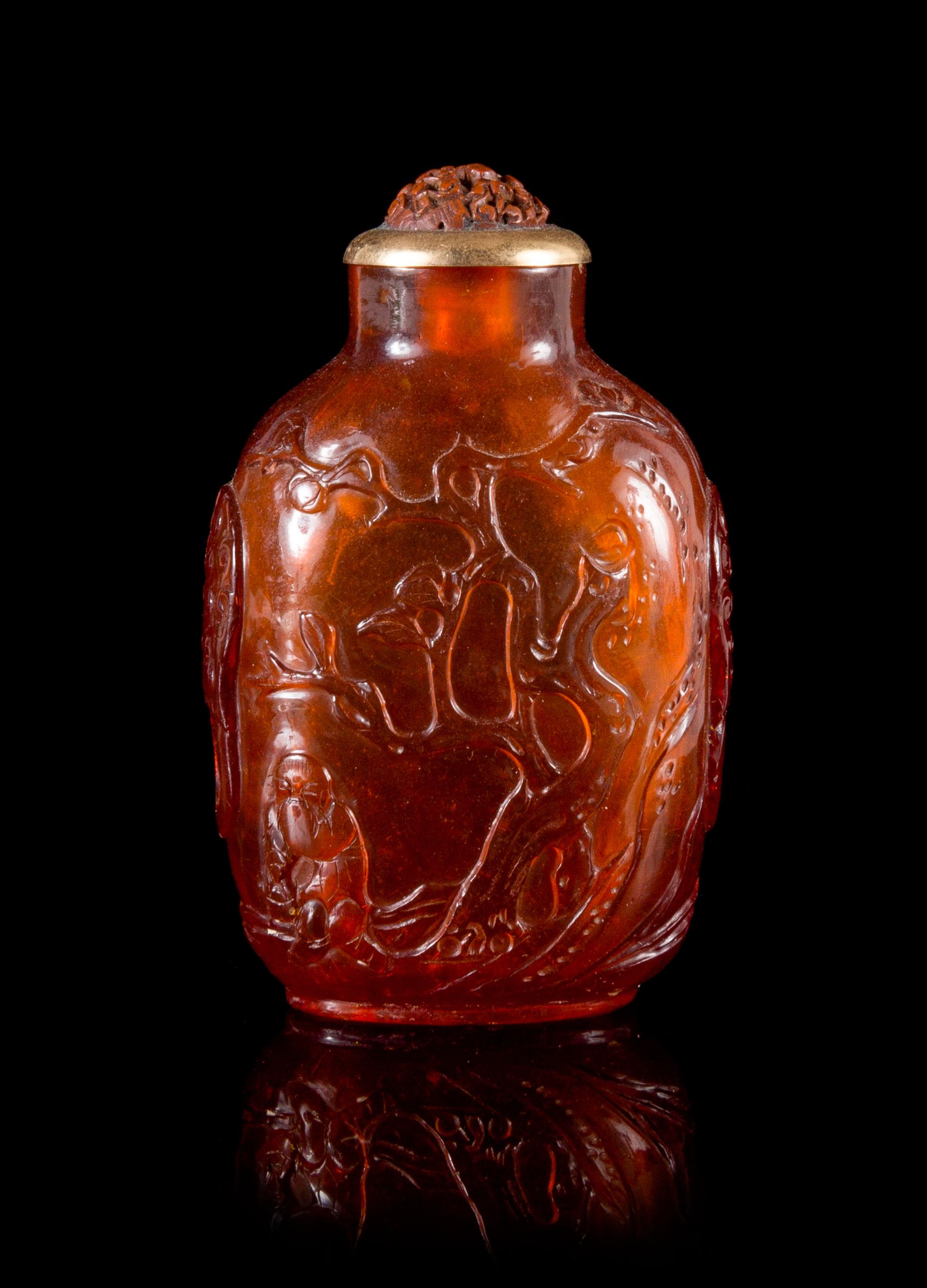 A Carved Amber Snuff Bottle Height 2 3/4 inches. — QIANLONG PERIOD (1736-1795)