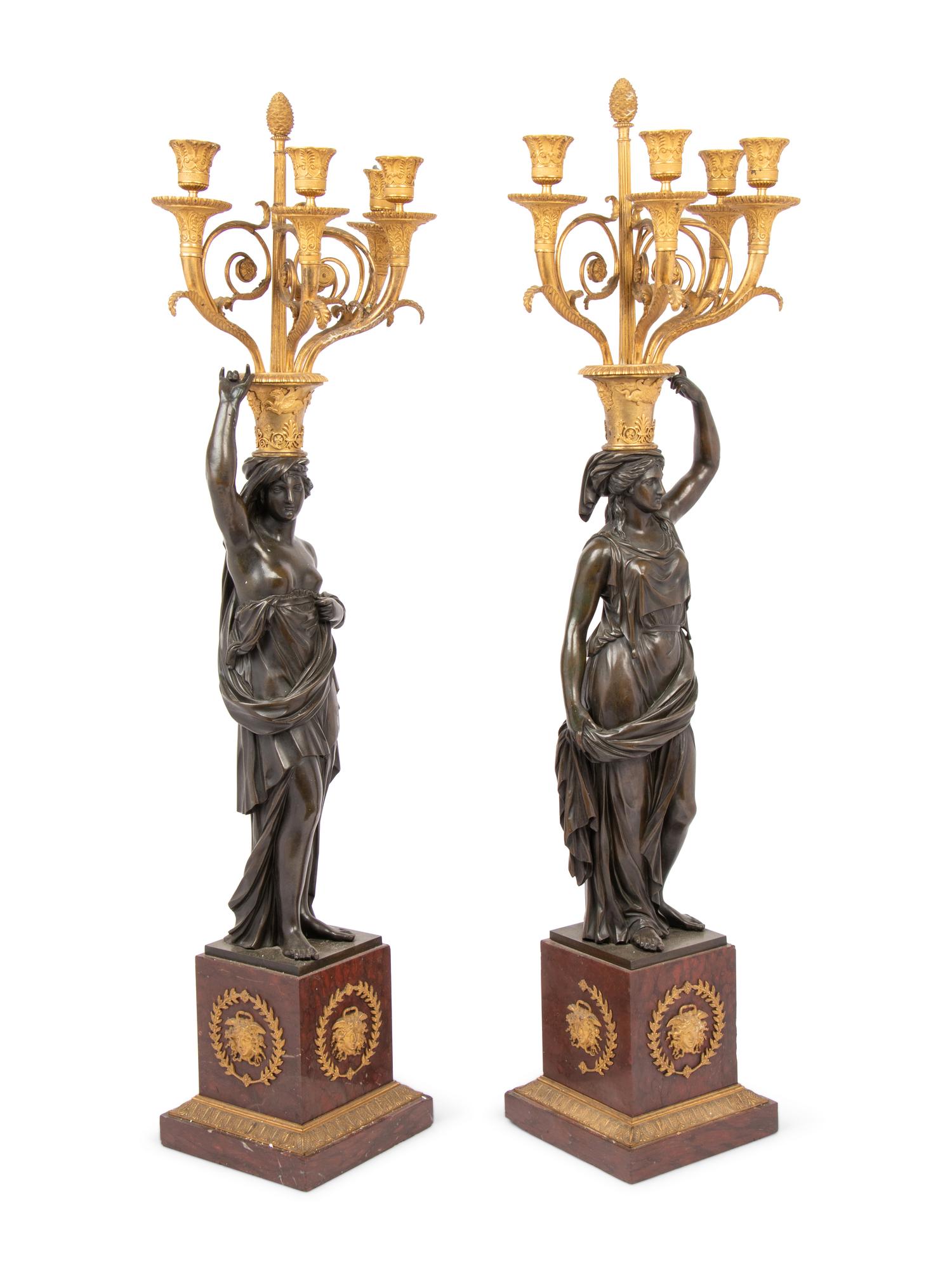 A Pair of Empire Style Gilt and Patinated Bronze and Marble Figural Four-Light Candelabra