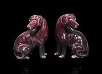 A pair of Chinese export aubergine-glazed porcelain seated dogs, 茄紫釉小狗一對