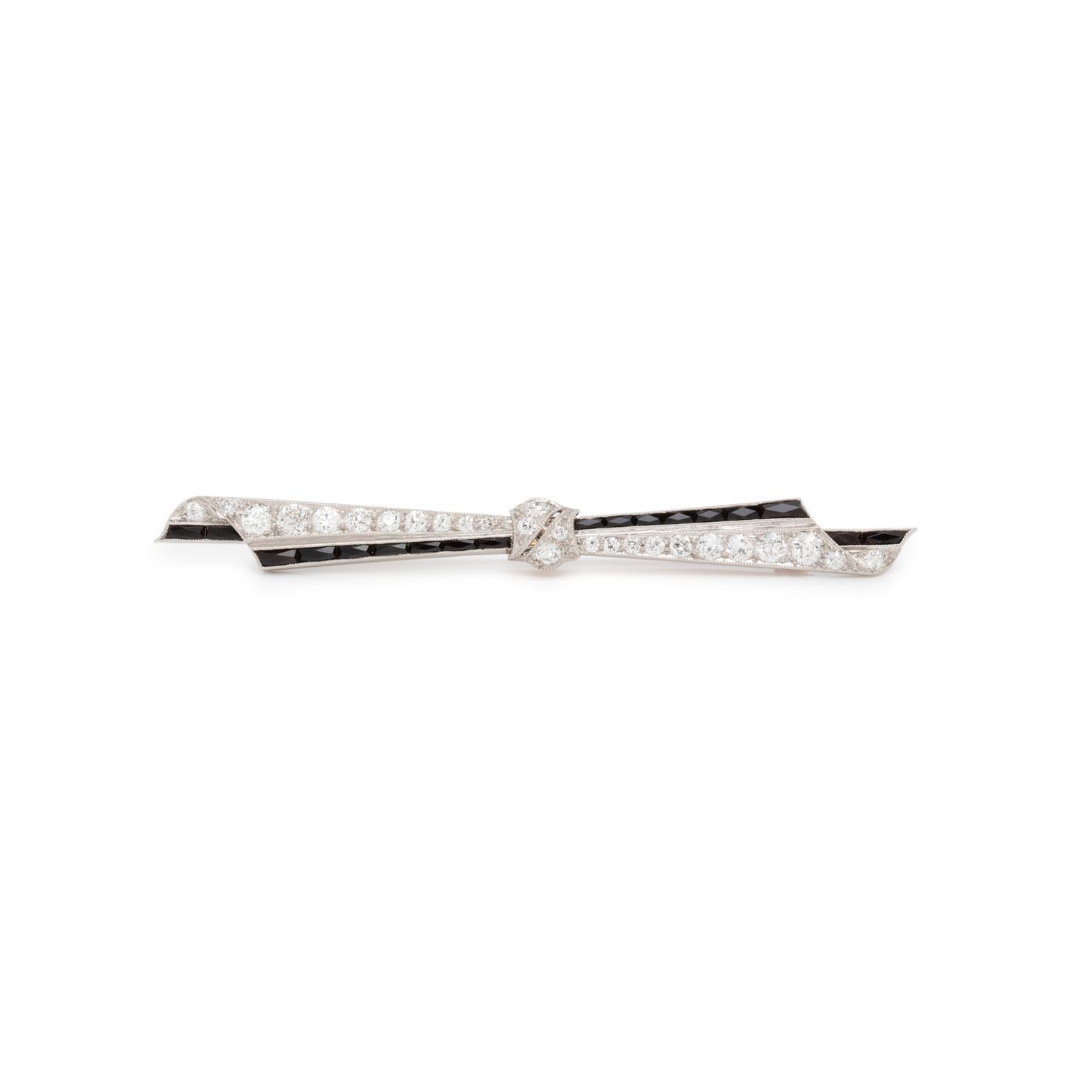 ART DECO, DIAMOND AND ONYX BOW BROOCH
