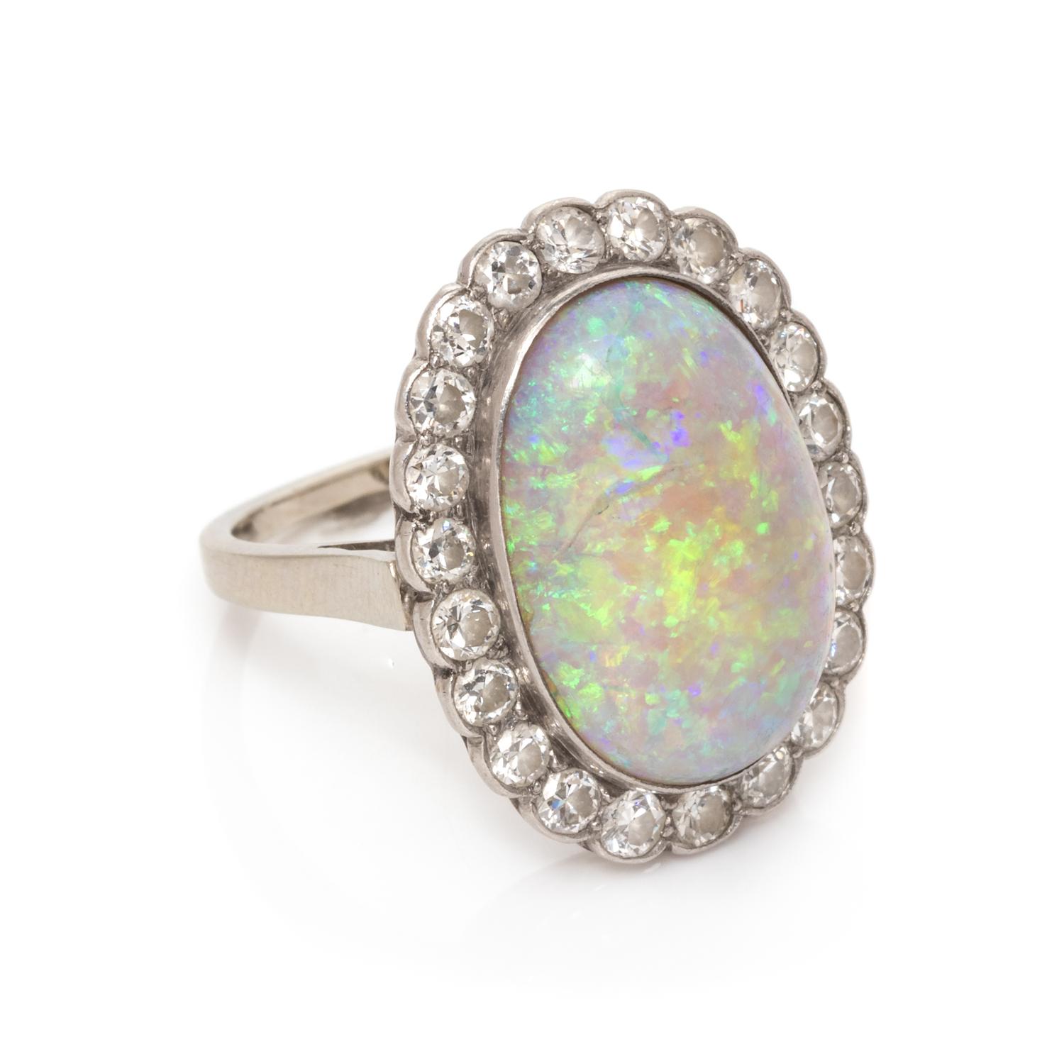 A Platinum, Opal and Diamond Ring, 3.85 dwts.