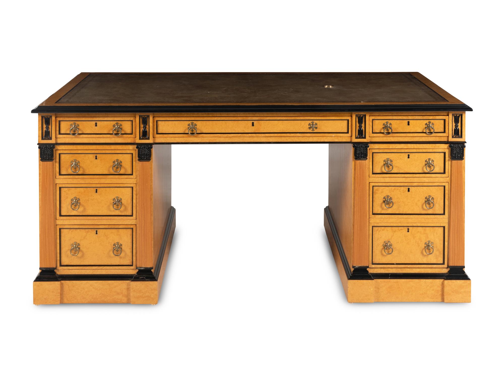 A Russian Neoclassical Style Birch and Parcel Ebonized Partner's Desk