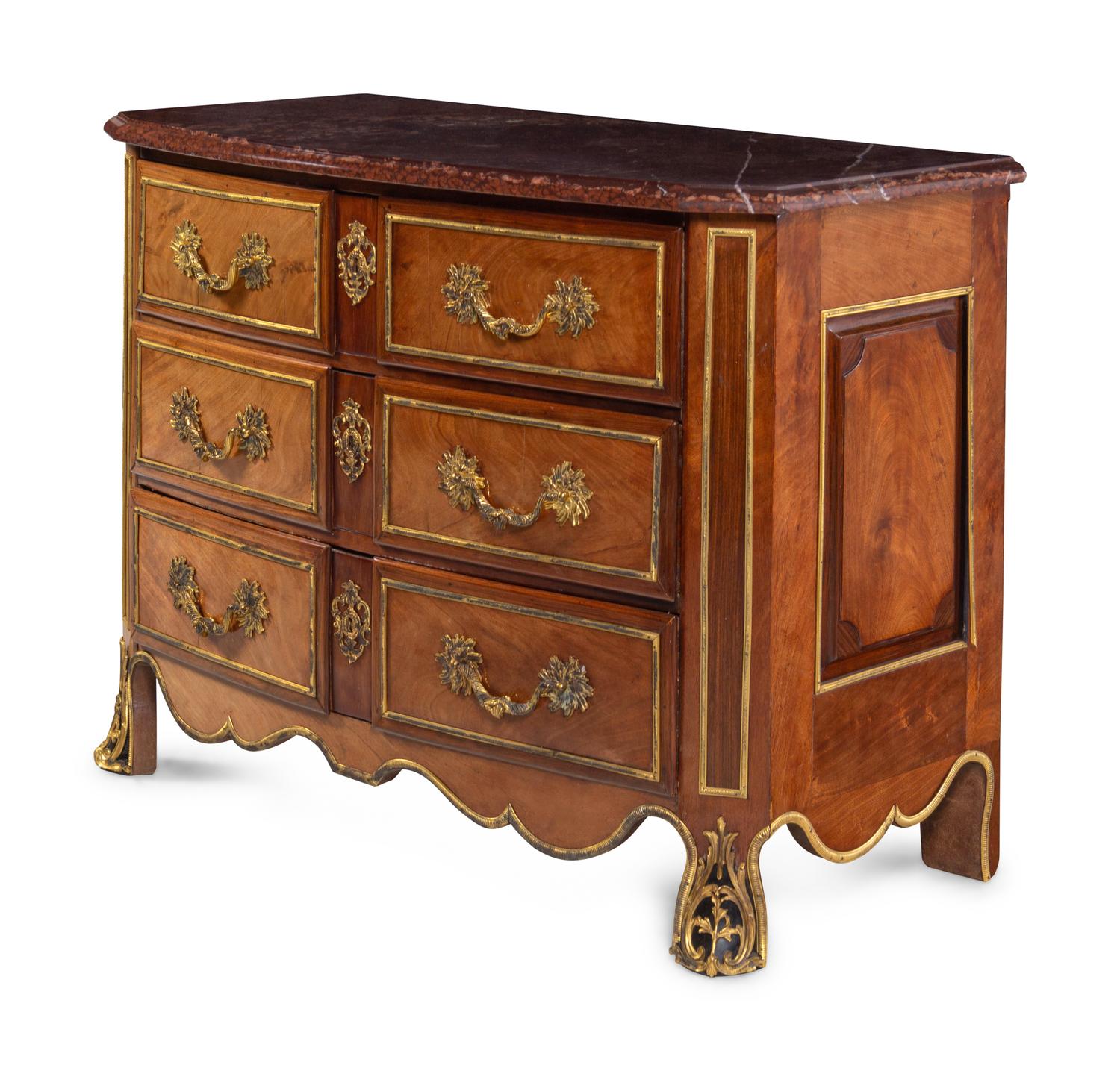 A Continental Gilt Bronze Mounted Mahogany Marble-Top Commode