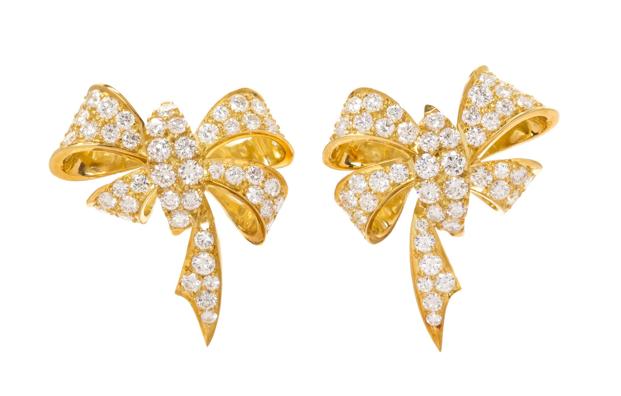 A Pair of Yellow Gold and Diamond Bow Motif Earclips, 11.00 dwts.