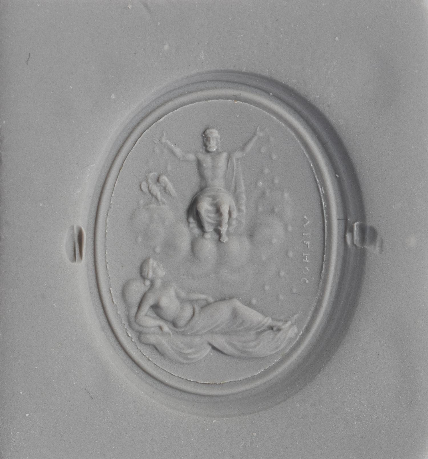 A Neoclassical Gold and Carnelian Finger Ring with the God Zeus, a Reclining Female, and a Greek Inscription