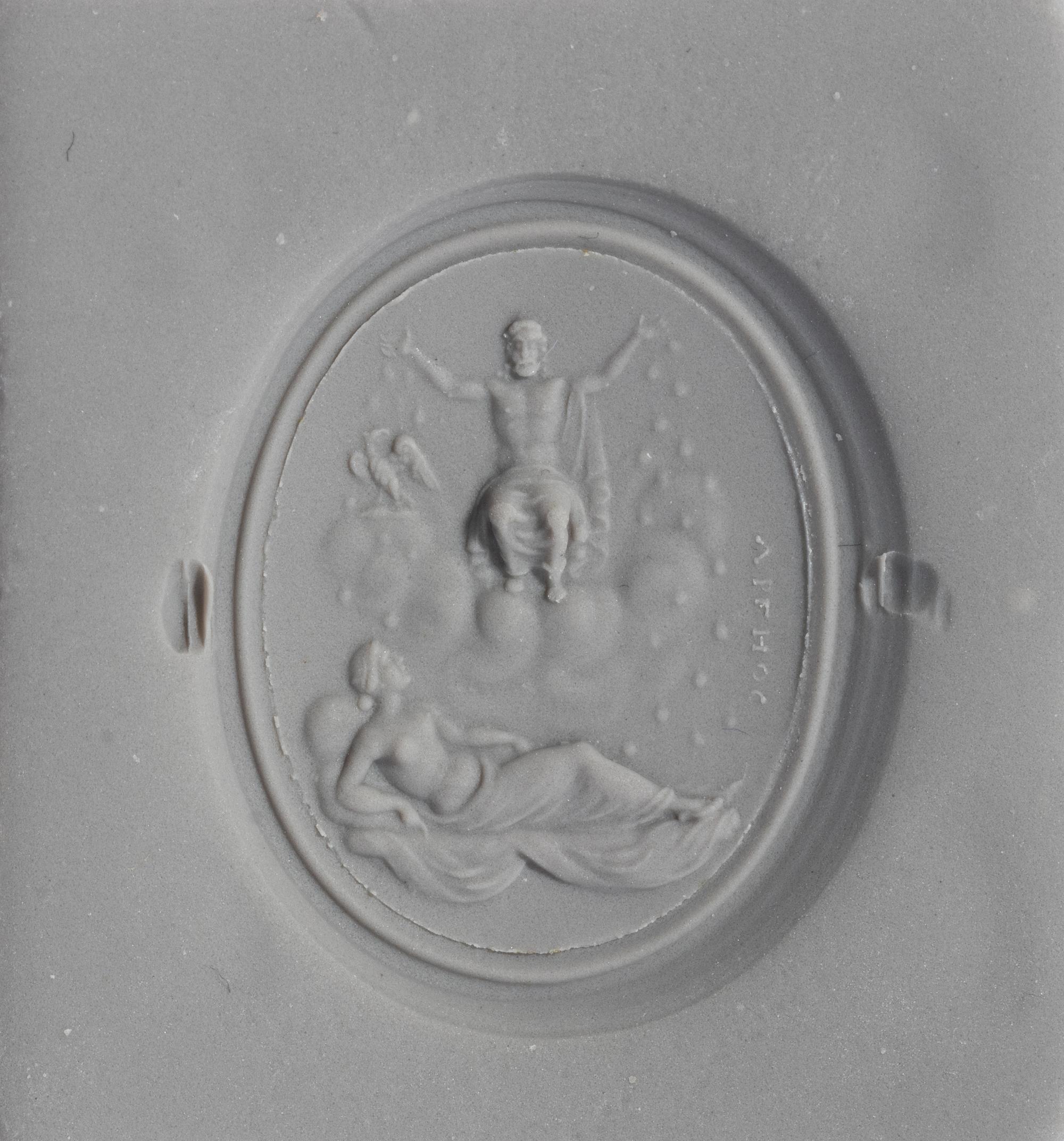 A Neoclassical Gold and Carnelian Finger Ring with the God Zeus, a Reclining Female, and a Greek Inscription