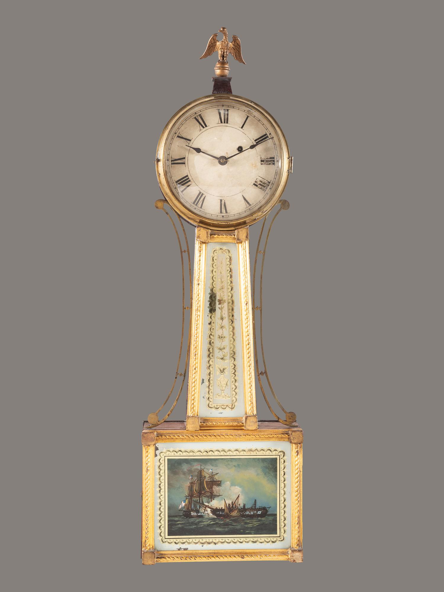 A Federal Giltwood, Brass and Eglomise War of 1812 Banjo Clock