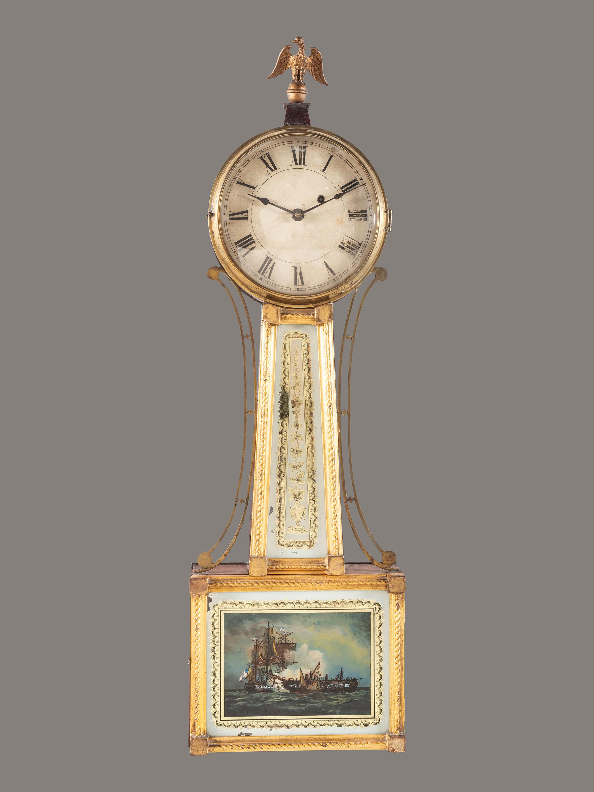 A Federal Giltwood, Brass and Eglomise War of 1812 Banjo Clock