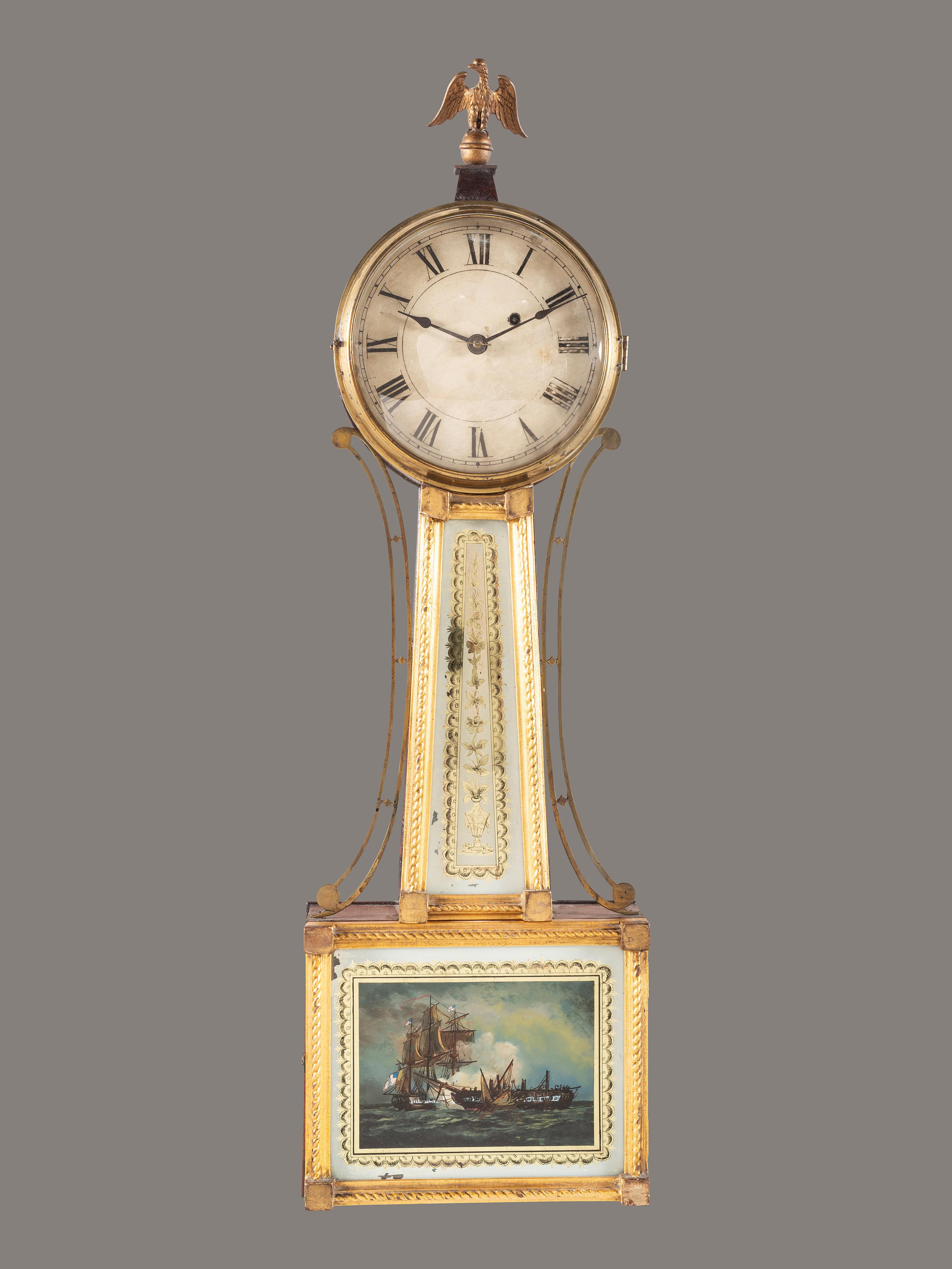 A Federal Giltwood, Brass and Eglomise War of 1812 Banjo Clock