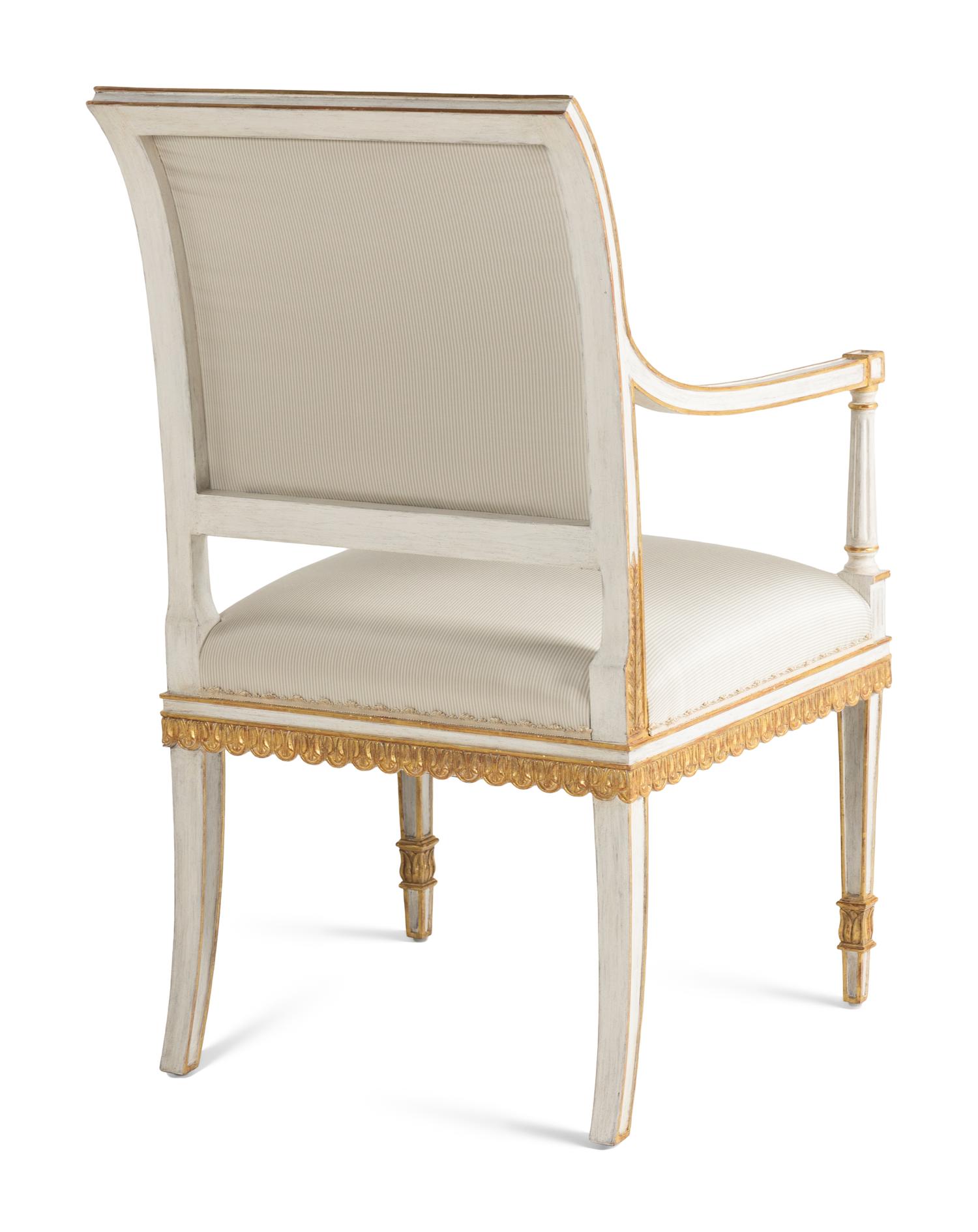 A Pair of Painted and Parcel Gilt Armchairs
