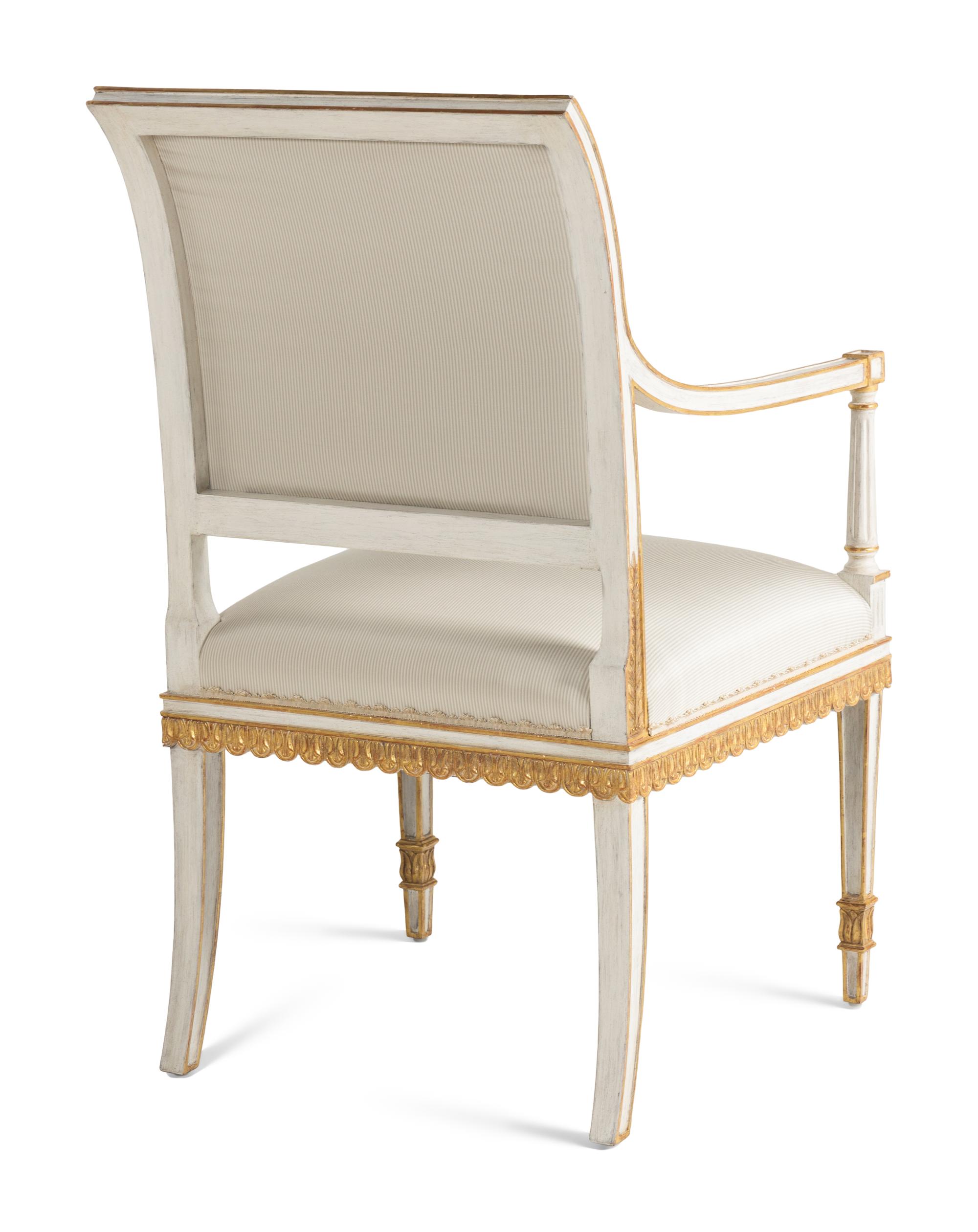 A Pair of Painted and Parcel Gilt Armchairs