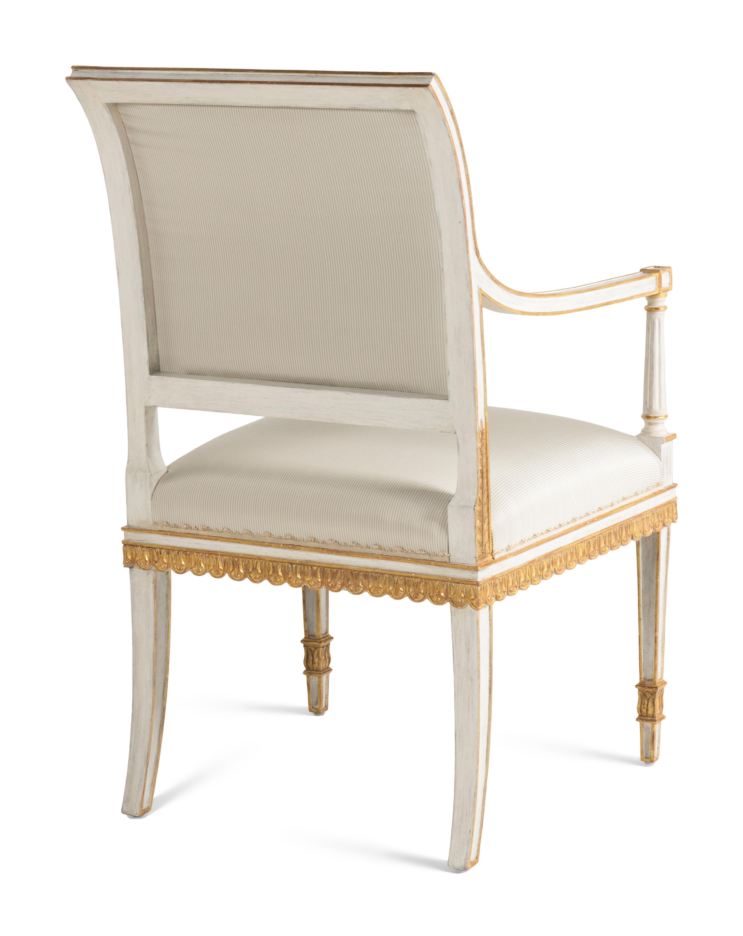 A Pair of Painted and Parcel Gilt Armchairs