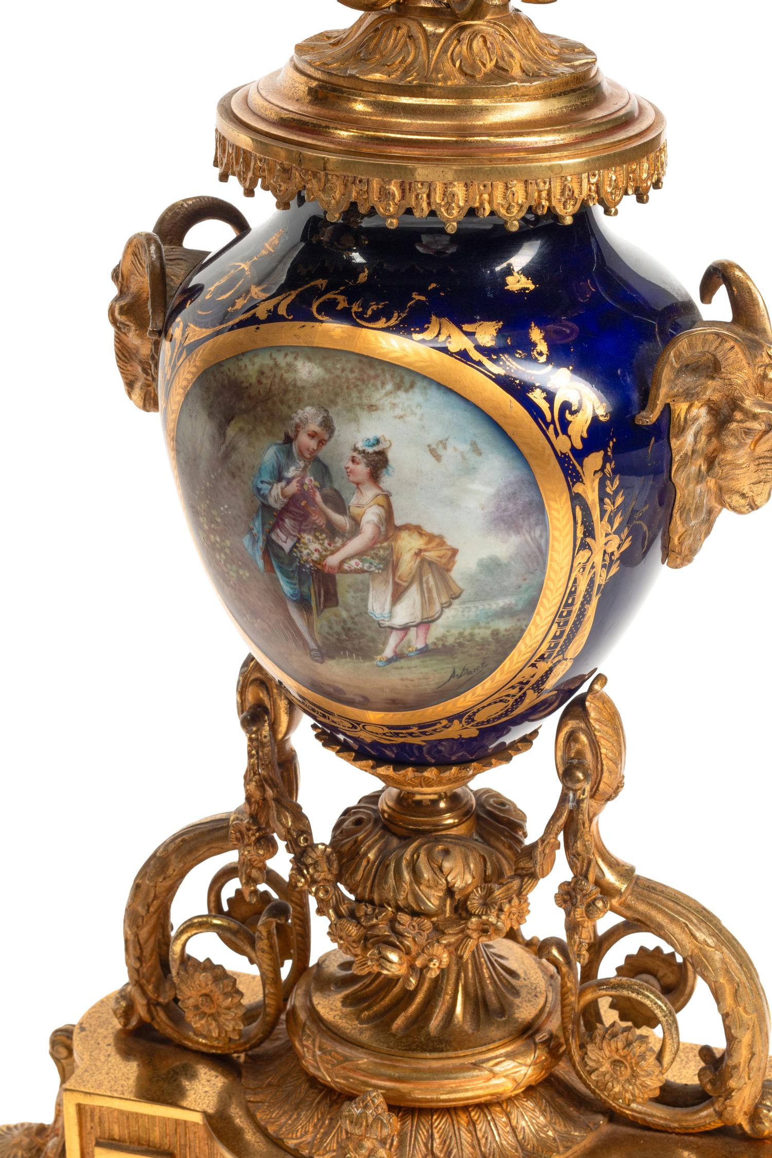 A Louis XVI Style Gilt Bronze and Sèvres Style Porcelain Clock Garniture