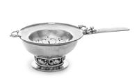 A Danish Silver Tea Strainer on Stand, Georg Jensen Silversmithy, Copenhagen, 1945-77, Blossom pattern, each with monogrammed initial K