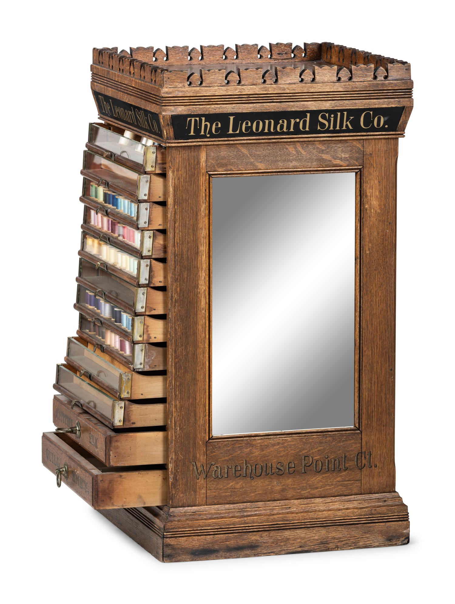A Leonard Silk Co. Oak Floor Spool Cabinet