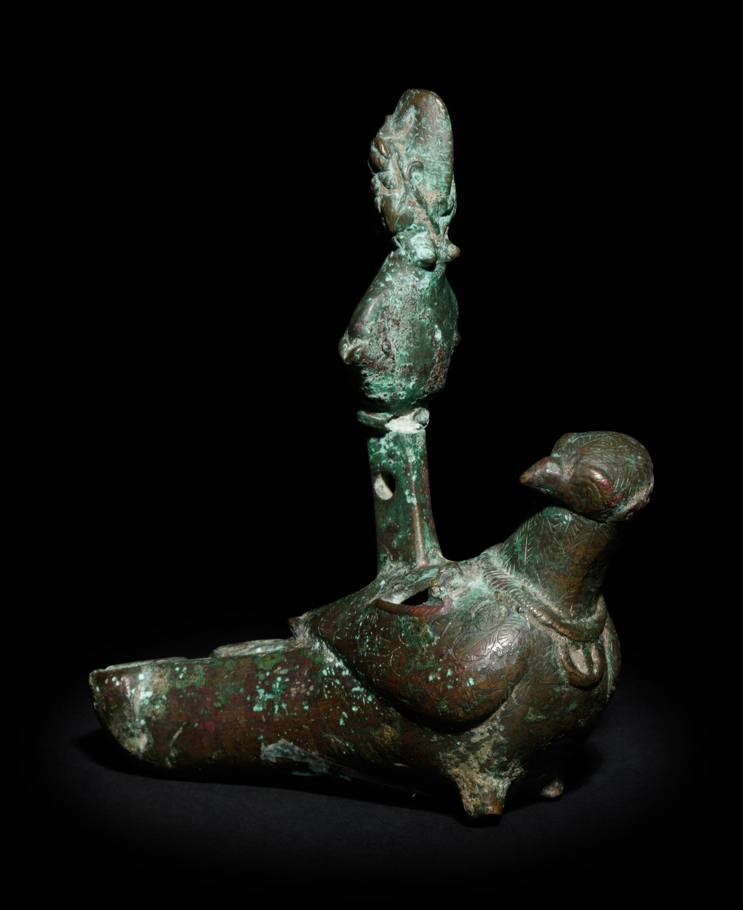 A Roman Bronze Oil Lamp in the Shape of a Dove with the Bust of a Goddess
