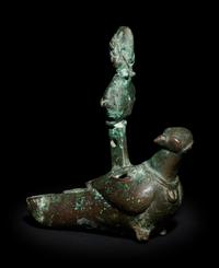 A Roman Bronze Oil Lamp in the Shape of a Dove with the Bust of a Goddess