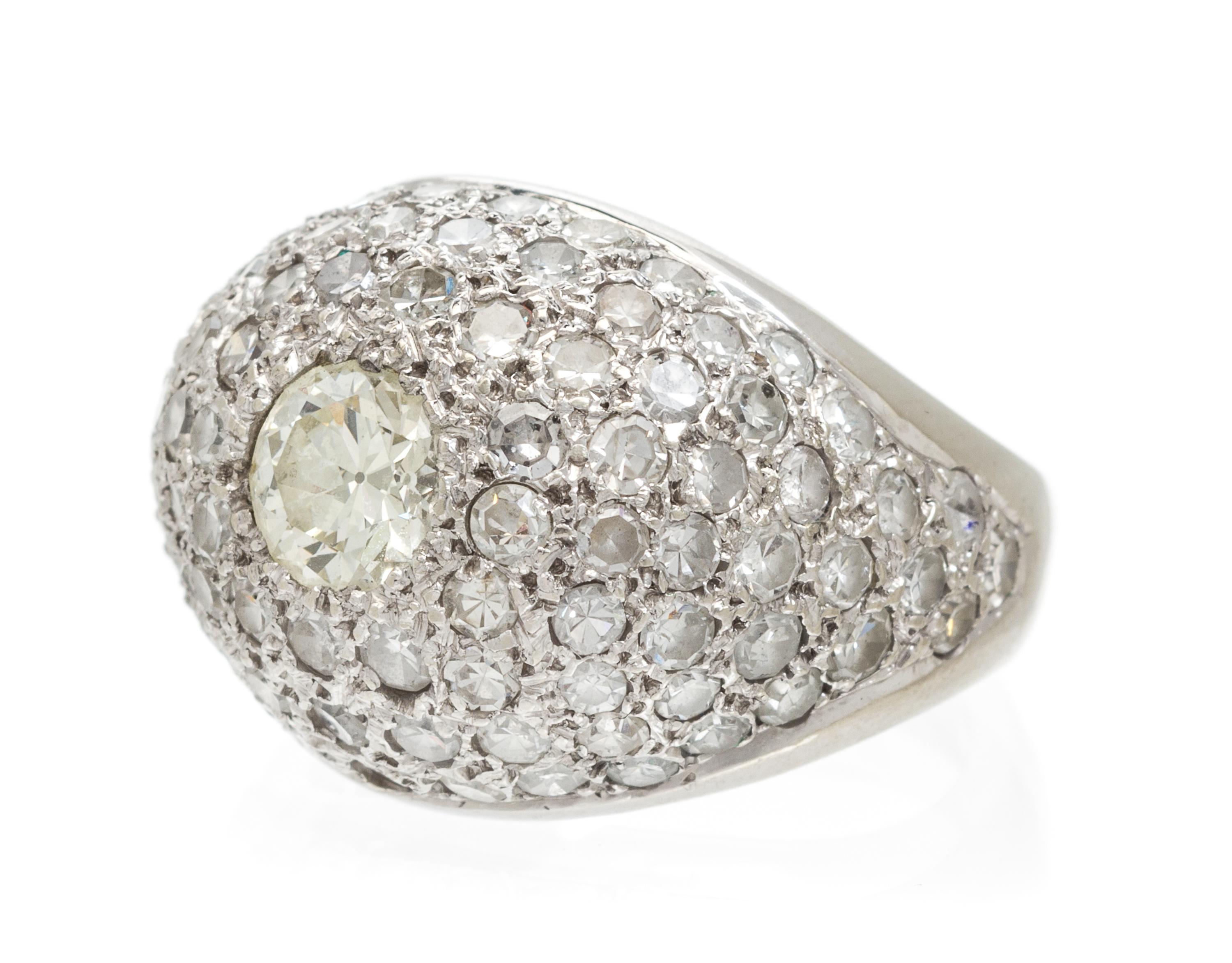 A 14 Karat White Gold and Diamond Dome Ring, 8.70 dwts.