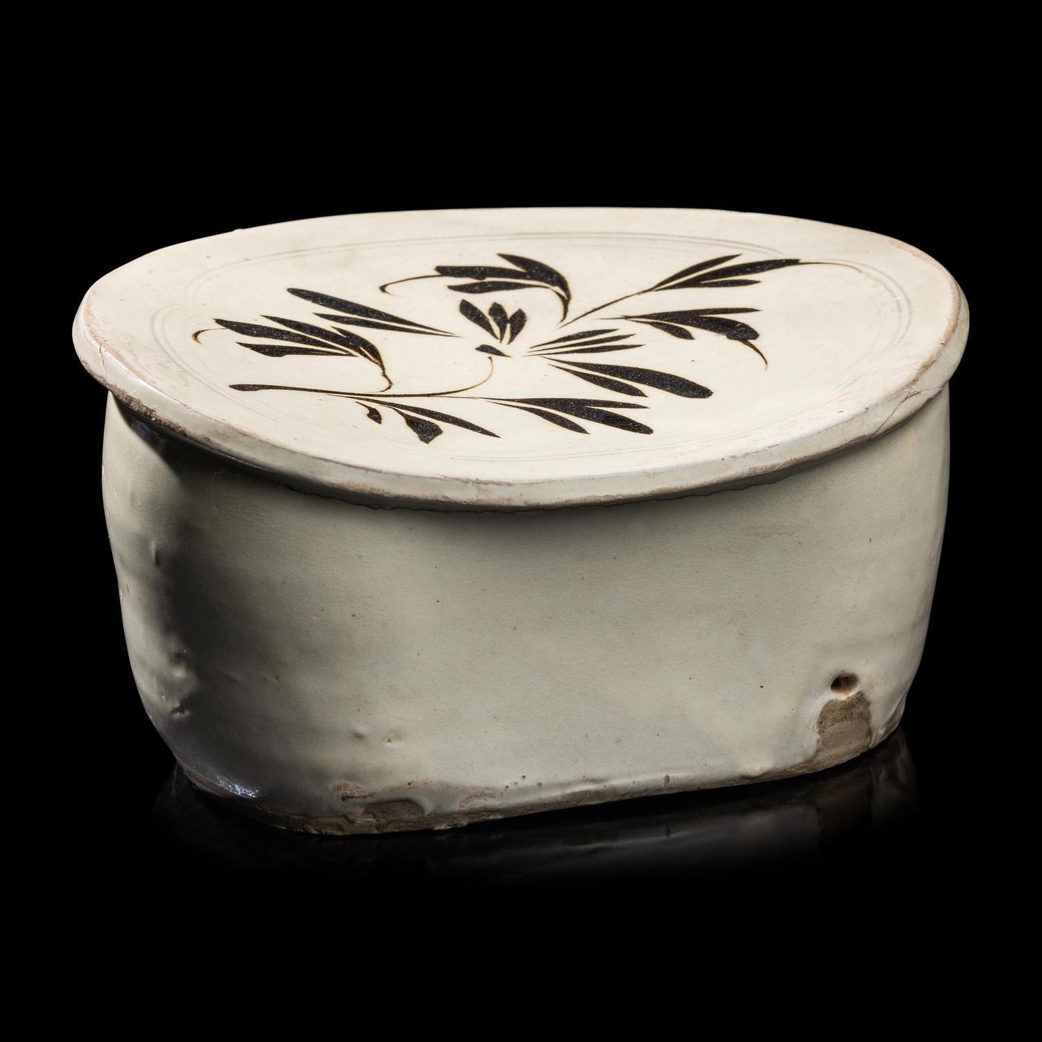 A Chinese Cizhou- Type White Glazed 'Floral' Porcelain Pillow, Yuan Dynasty 元 磁州窯白釉花卉紋枕