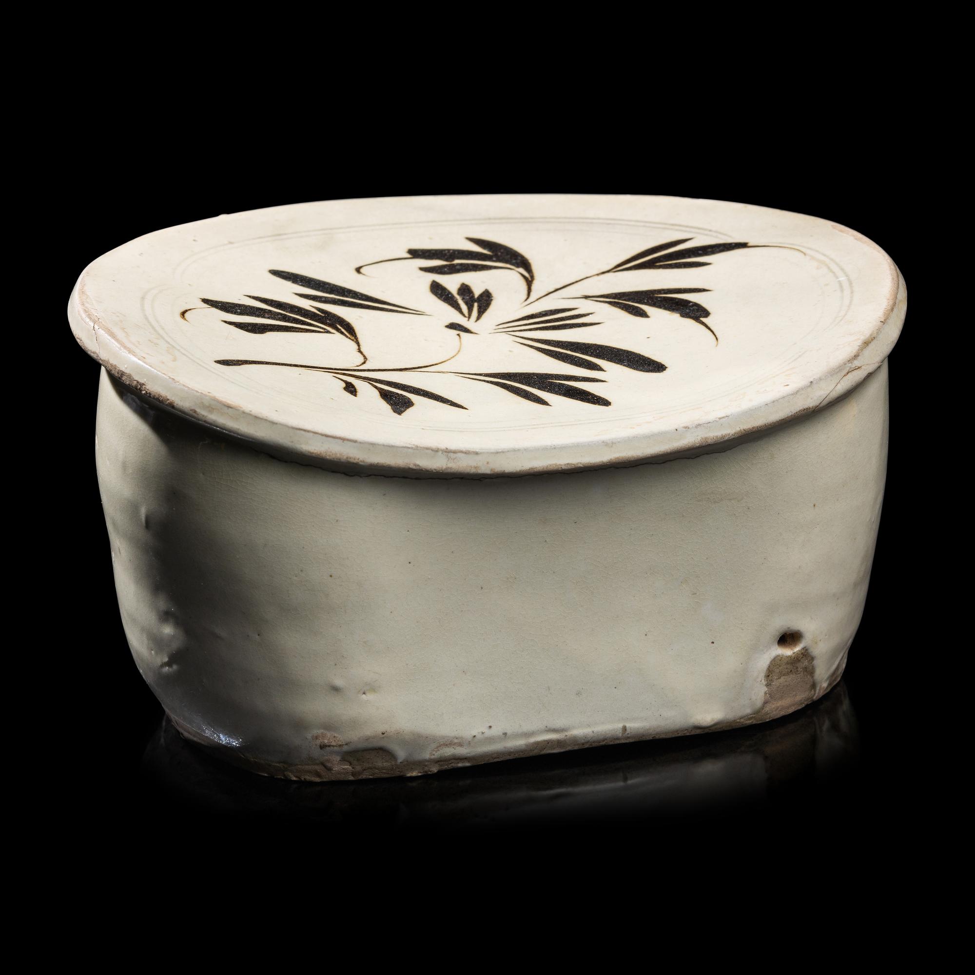 A Chinese Cizhou- Type White Glazed 'Floral' Porcelain Pillow, Yuan Dynasty 元 磁州窯白釉花卉紋枕