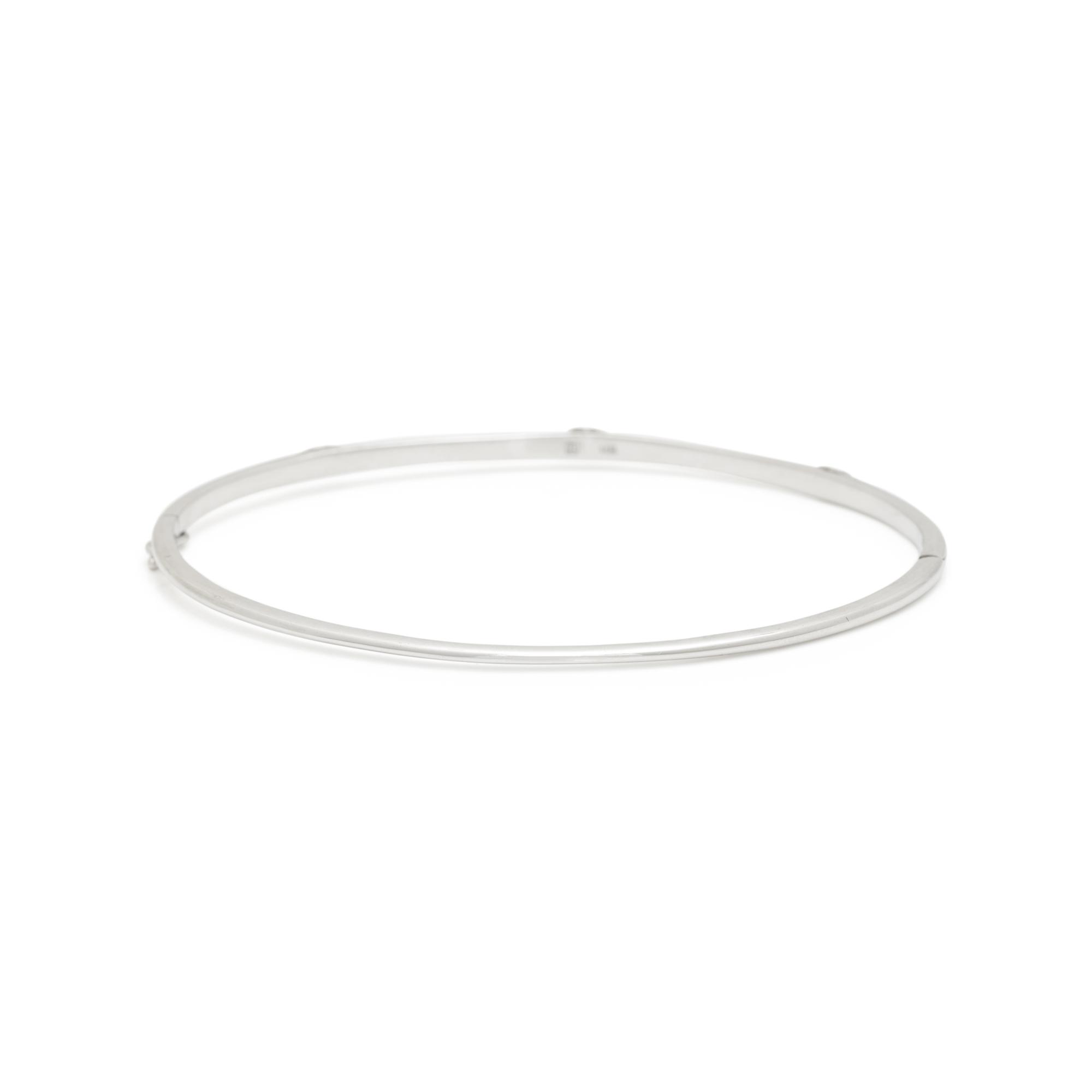 ANNA SHEFFIELD, WHITE GOLD AND DIAMOND 'CELESTINE' BANGLE BRACELET