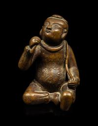 A Small Chinese Bronze Figure of a Seated Boy